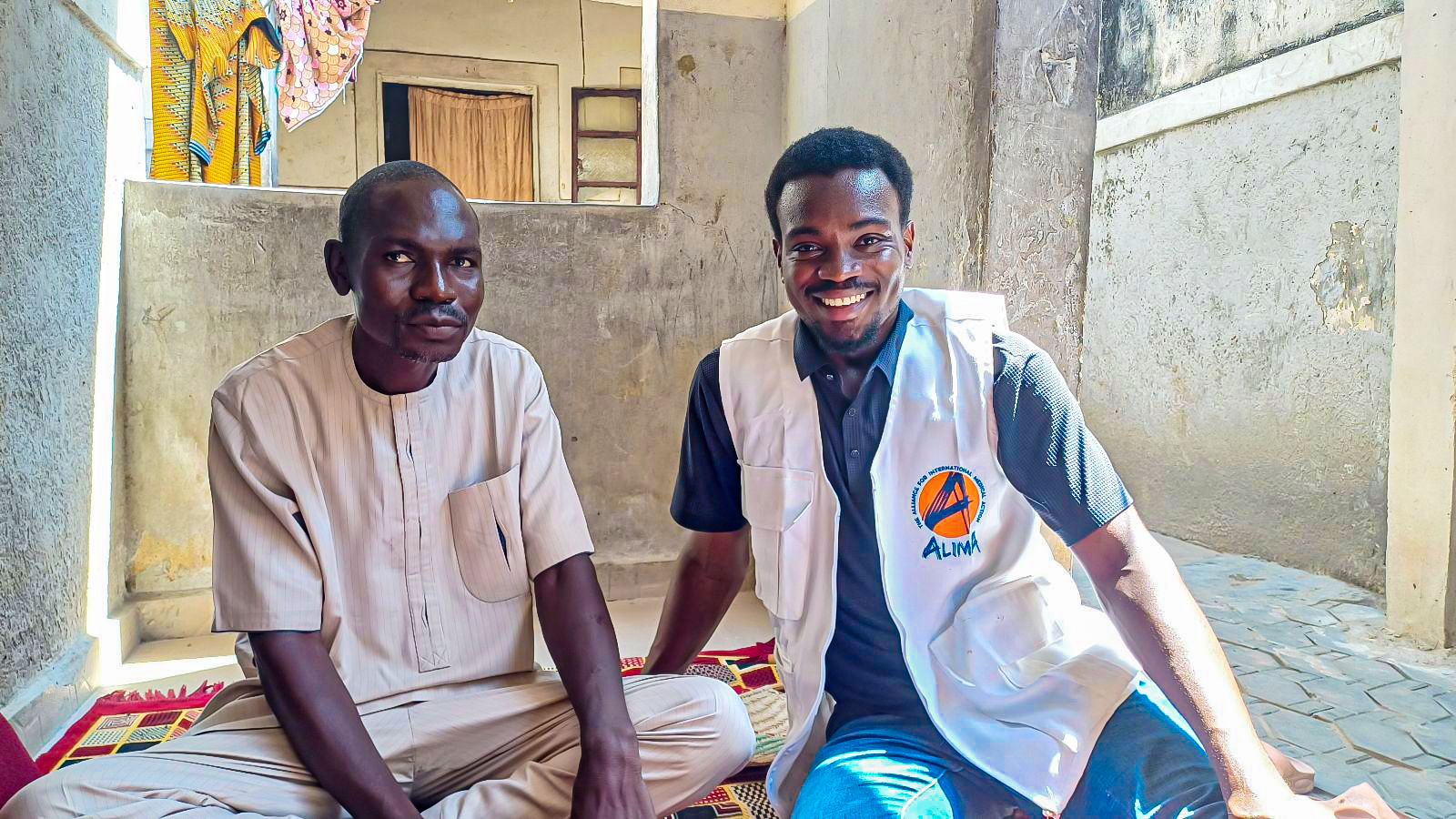 Laman Mamman in his Goni Kachallari home with Dr Haruna Tarfa Medical Activities Manager ALIMA